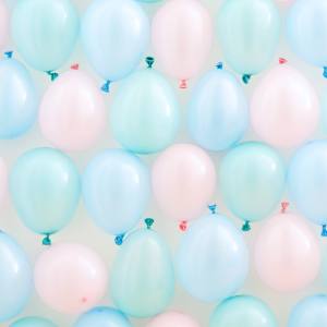 Image of a green, blue and pink pastel balloon wall.