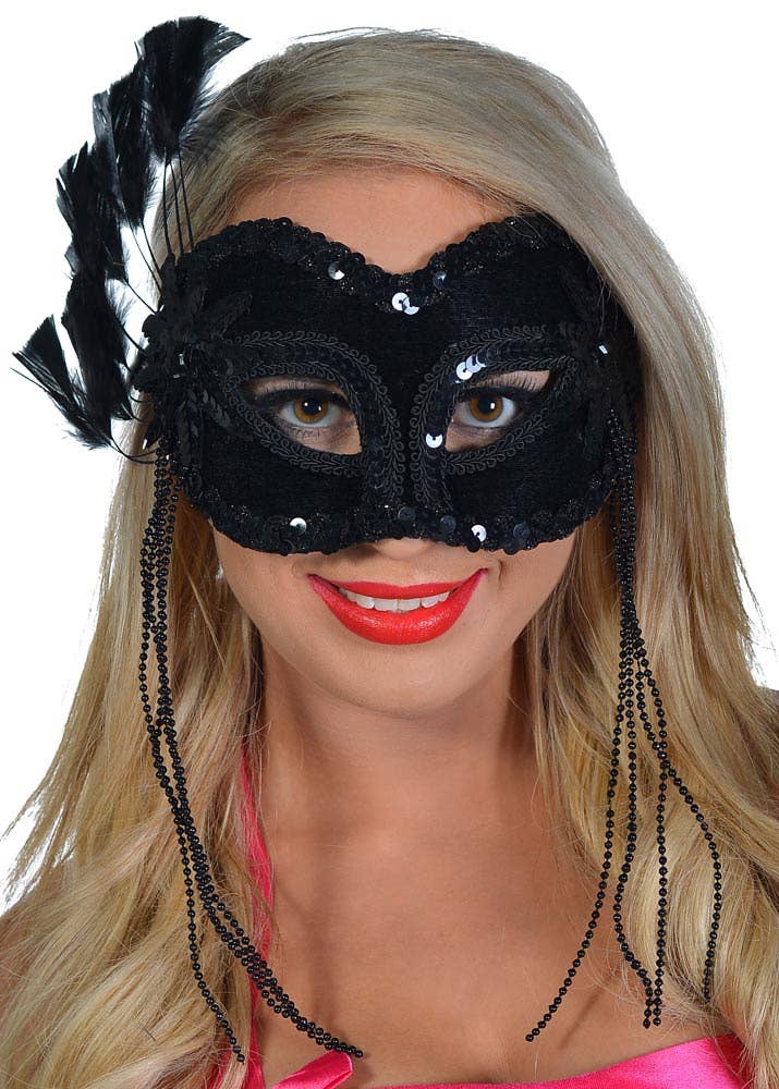 Black Sequin Masquerade Mask With Feather Fan Appliqué and Side Tassels - View 1