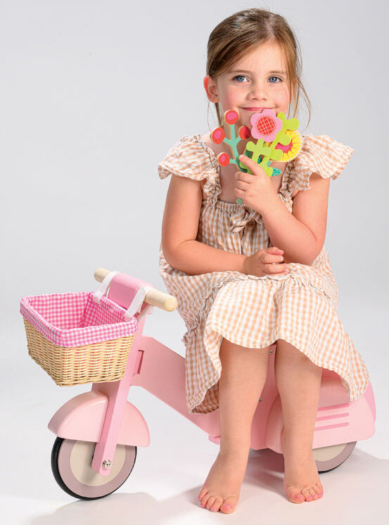 Pink Wooden Toy Scooter For Children - Lifestyle Image 2