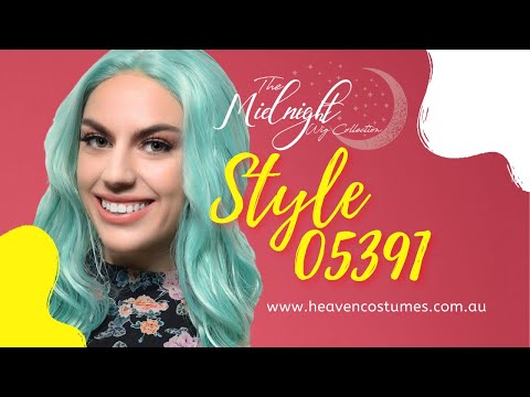 A person modelling this mint green wig with information about the wig written on the side.