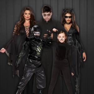 Image of 3 adults and two kids wearing black coloured costumes.