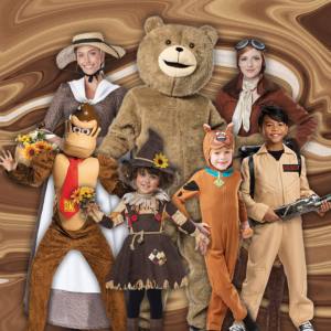 Image of 3 adults and 4 kids wearing different brown coloured costumes, included characters are a Pioneer, Ted, Amelia Earhart, Donkey Kong, a Scarecrow, Scooby Doo and a Ghostbuster.