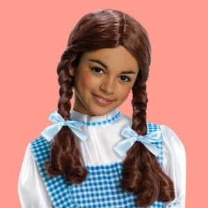 Image of kids dressed as and angel and devil with different costume accessories, including a pitchfork, angel halo and wings.