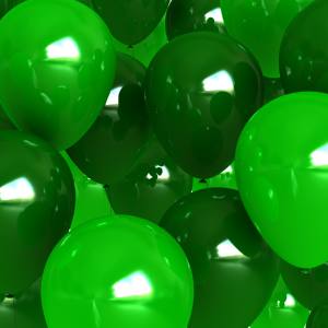 Image of a group of light and dark green party balloons.