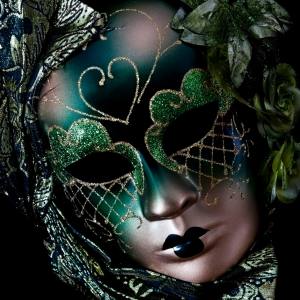 Image of a green Venetian style masquerade mask.