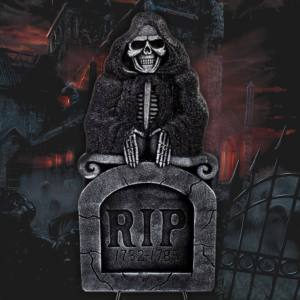 Image of a Grim Reaper themed gravestone decoration.