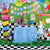 Image of a Mad Hatters tea party set up, with bunting flags, party decorations, Alice in Wonderland cut out, and decorated Wonderland table.