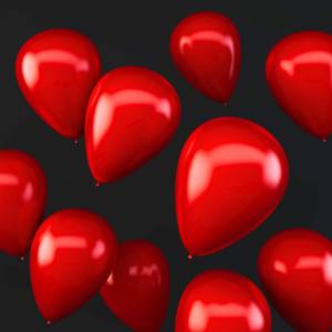 Image of floating red balloons with a black background.