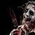 Image of a zombie man holding a toy Halloween knife with blood splatter details.