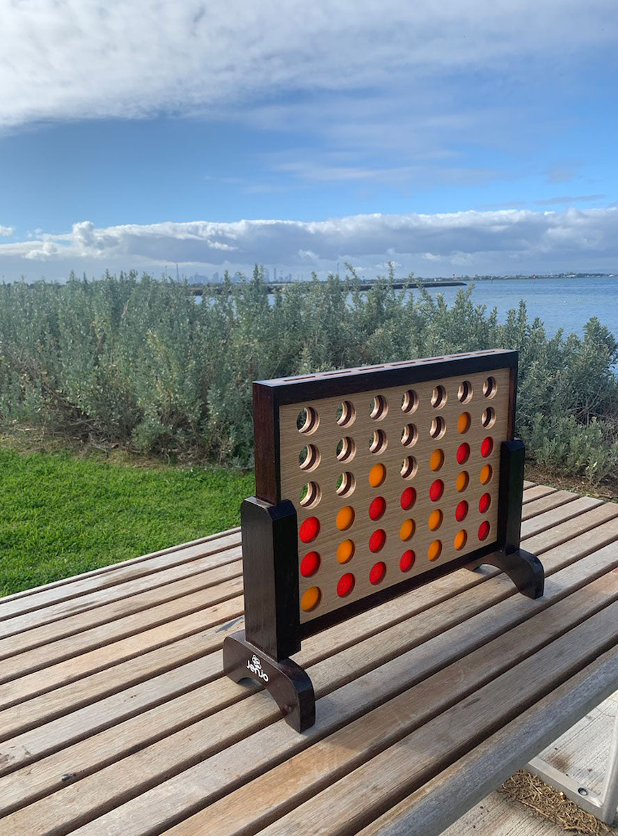 4 In A Row 52cm Hardwood Indoor Game - Lifestyle Image 1