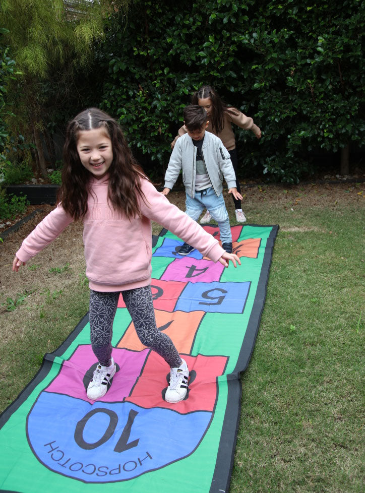 Colourful 3m Long Hopscotch Mat With Petal Pegs Kids Lawn Game - Lifestyle Image 3
