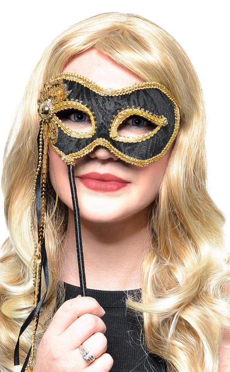 Elegant Hand Held Black Velvet and Gold Braid Masquerade Mask - Main Image