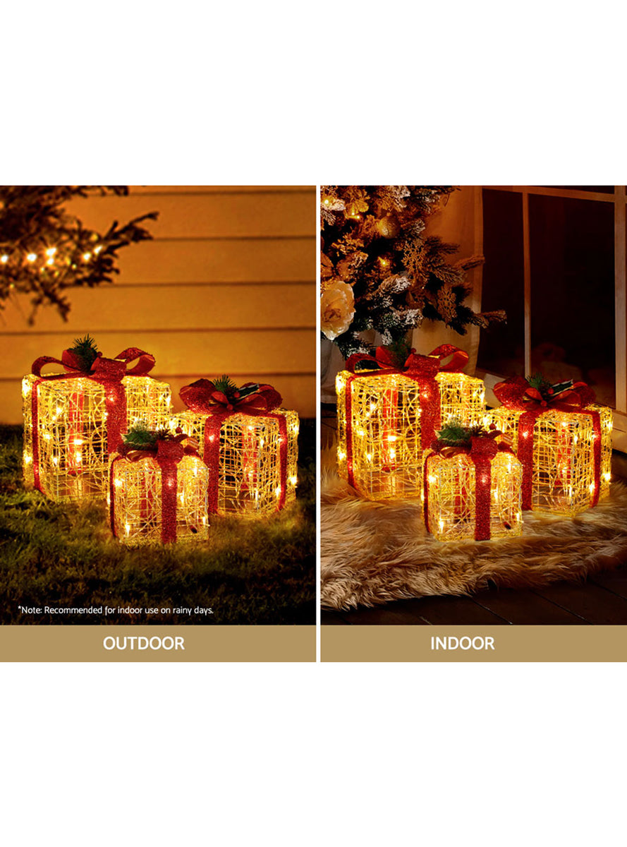 Light Up Jingle Jollys 3 Piece Red Bow Gold Gift Box Christmas Decorations - Indoor Outdoor Image