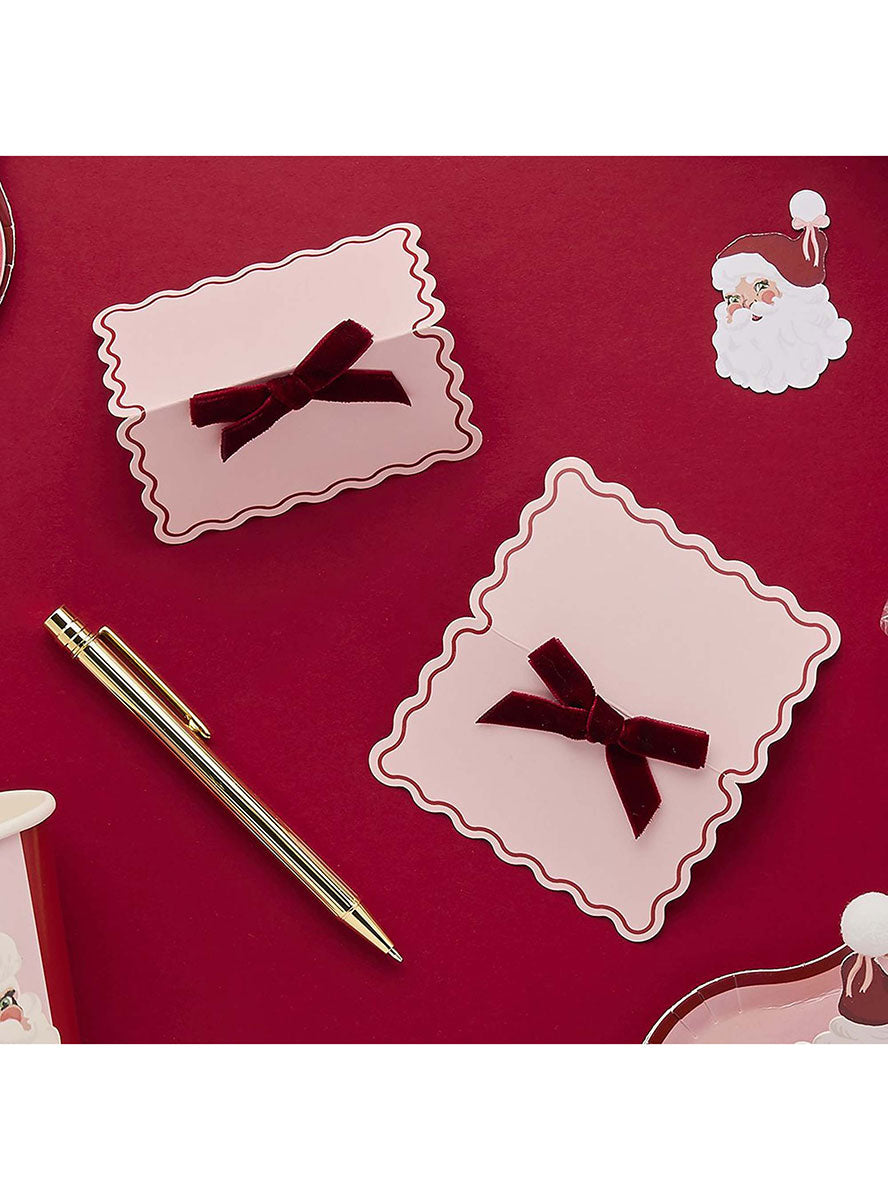 Santa Baby Pink And Red Christmas Place Cards 10 Pack – Lifestyle Image 1