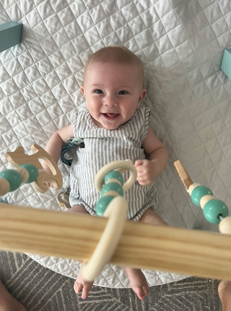 Wooden Baby Playgym With 3 Attached Wooden Toys - Lifestyle Image