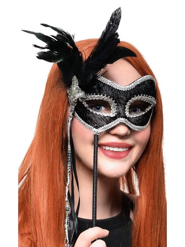Feathered Black and Silver Hand Held Masquerade Mask - Main Image